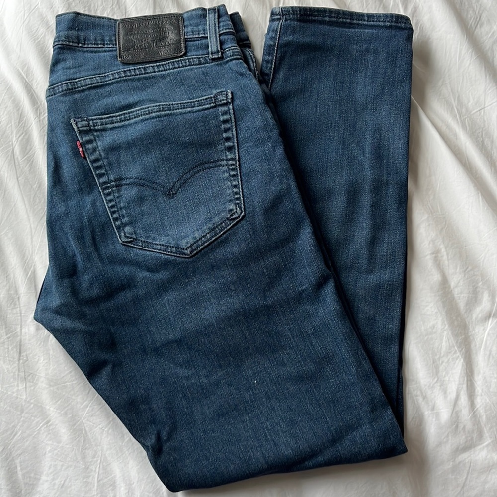 LEVIS 512 Slim Taper Fit Men’s Jeans in dark wash.